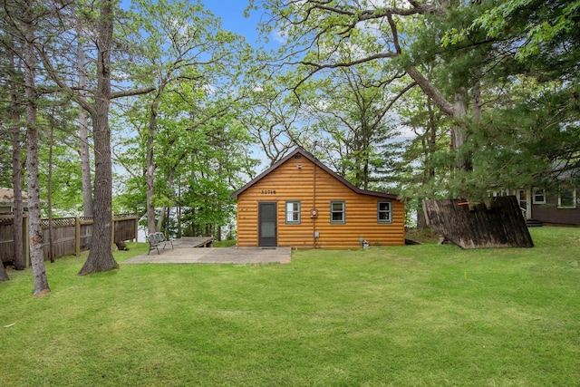 22718 Martin Lake Dr NE, Linwood Twp, MN 55092 - back of house with a patio area and faux log siding