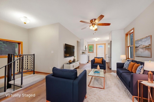 22718 Martin Lake Dr NE, Linwood Twp, MN 55092 - living room featuring light wood-type flooring and ceiling fan