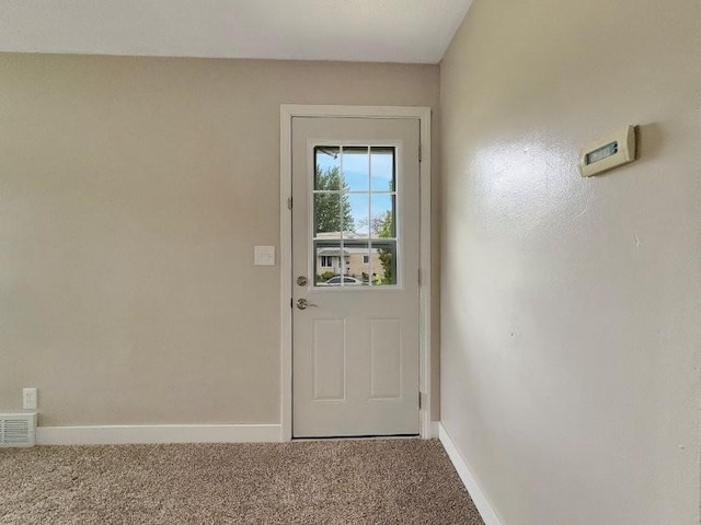 306 Blinkman St, Fairmont, MN 56031 - doorway featuring carpet flooring and baseboards
