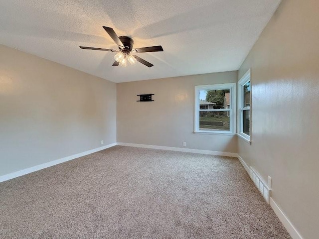306 Blinkman St, Fairmont, MN 56031 - carpeted spare room with ceiling fan, a textured ceiling, and baseboards