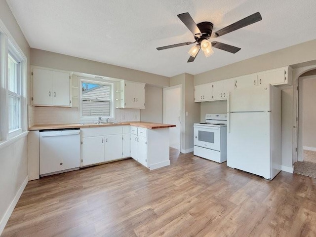 306 Blinkman St, Fairmont, MN 56031 - kitchen featuring white appliances, a sink, baseboards, and ceiling fan