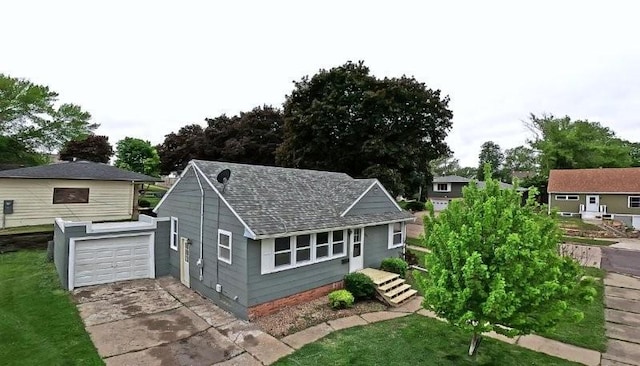 306 Blinkman St, Fairmont, MN 56031 - view of front facade with concrete driveway, roof with shingles, and a garage