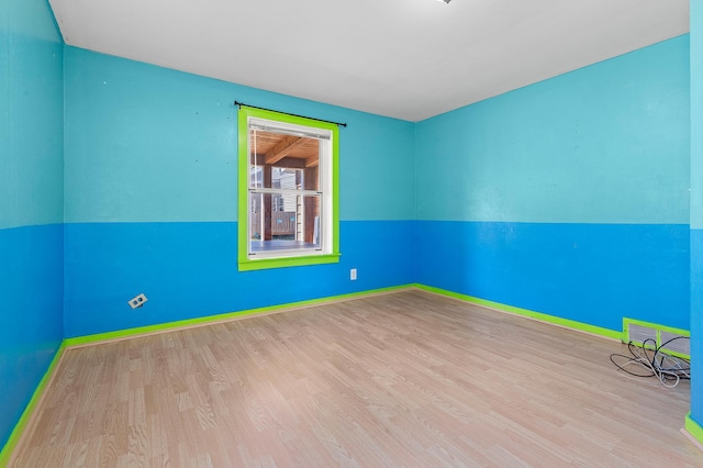 1391 Main St, Saint Joseph Twp, WI 54082 - empty room featuring wood finished floors and baseboards