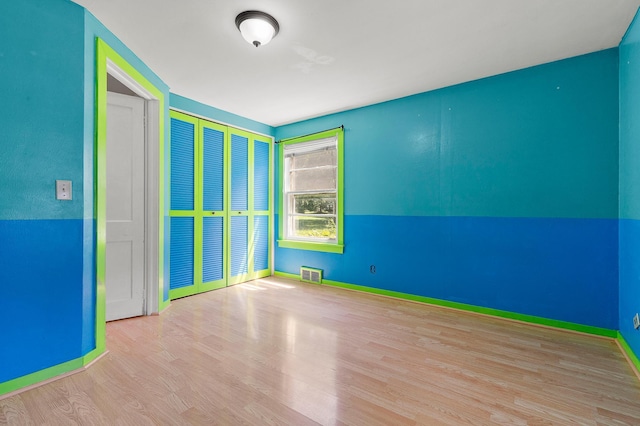 1391 Main St, Saint Joseph Twp, WI 54082 - spare room featuring wood finished floors and baseboards