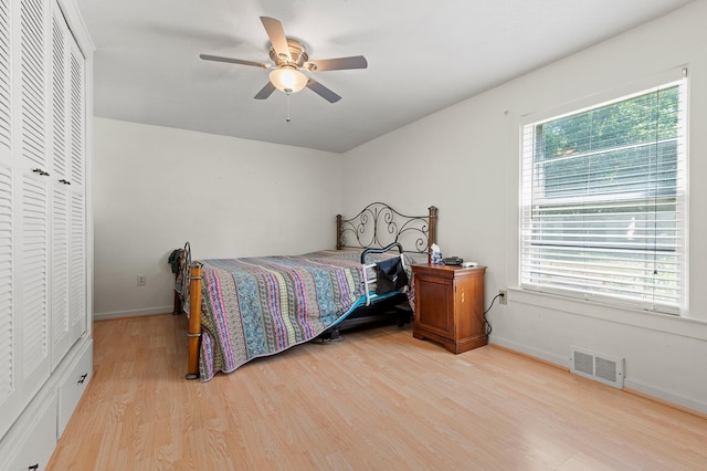 1391 Main St, Saint Joseph Twp, WI 54082 - bedroom featuring light wood-style floors, a closet, and ceiling fan