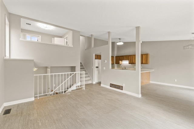 6007 Covington Ter, Minnetonka, MN 55345 - unfurnished living room featuring wood finished floors, baseboards, and stairs