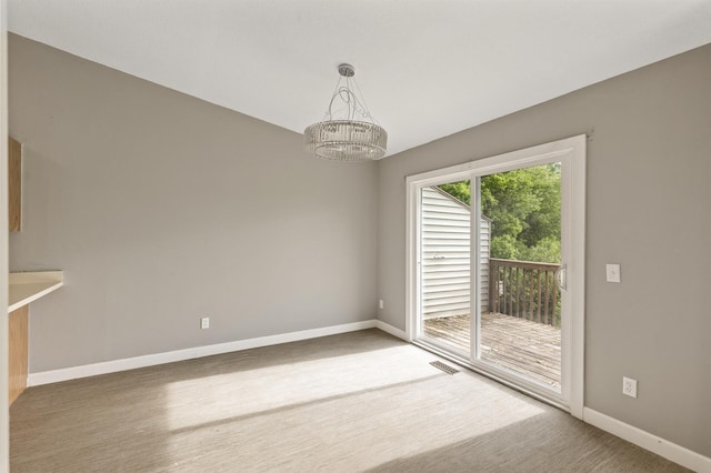 6007 Covington Ter, Minnetonka, MN 55345 - empty room featuring a chandelier and baseboards