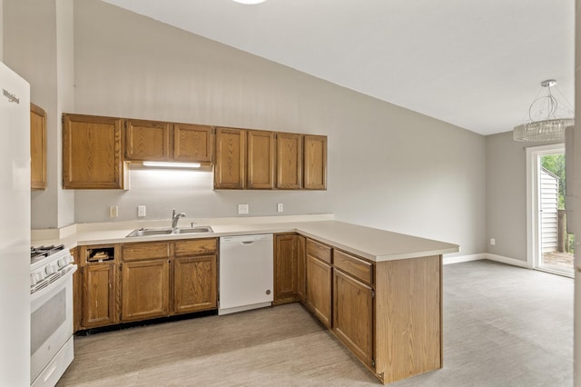 6007 Covington Ter, Minnetonka, MN 55345 - kitchen with white appliances, a peninsula, a sink, brown cabinetry, and high vaulted ceiling