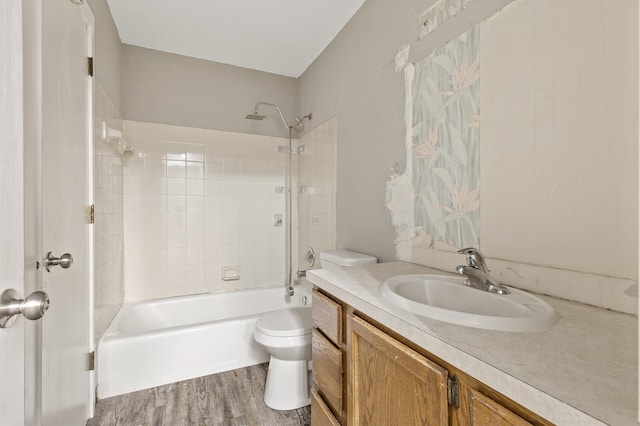 6007 Covington Ter, Minnetonka, MN 55345 - bathroom featuring toilet, vanity, wood finished floors, and  shower combination