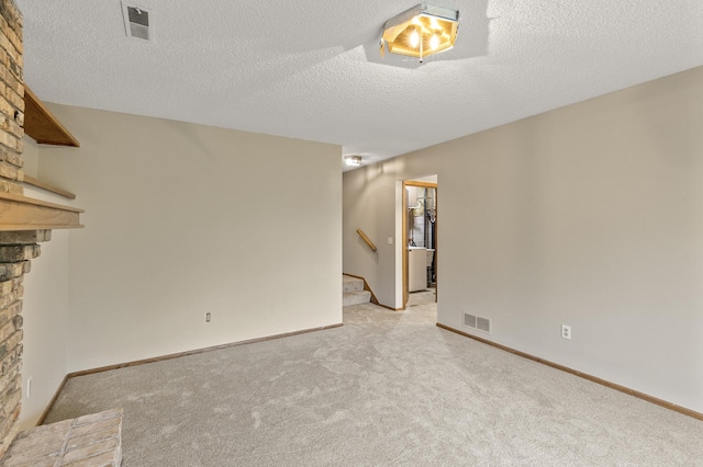 6007 Covington Ter, Minnetonka, MN 55345 - unfurnished living room featuring a large fireplace, stairs, light colored carpet, a textured ceiling, and baseboards