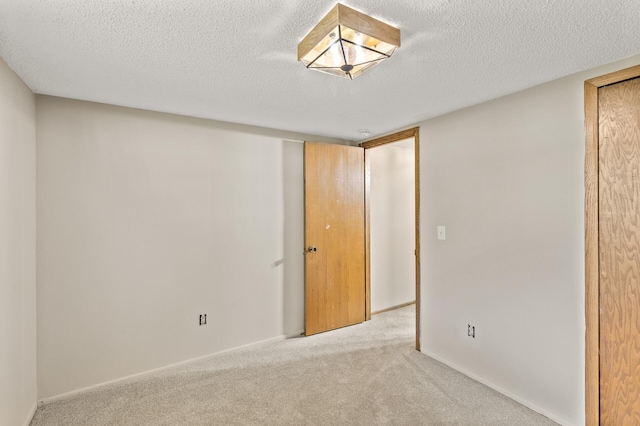 6007 Covington Ter, Minnetonka, MN 55345 - unfurnished bedroom with carpet, a textured ceiling, and baseboards