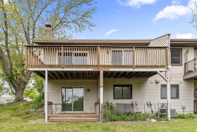 6007 Covington Ter, Minnetonka, MN 55345 - back of property with a chimney, a deck, and central air condition unit