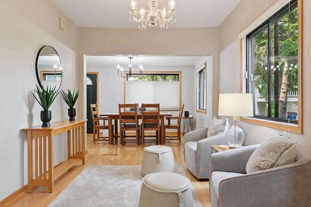 2452 Black Lake Rd, Spring Park, MN 55384 - living area with a chandelier and light wood-style flooring