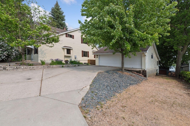 2452 Black Lake Rd, Spring Park, MN 55384 - view of property hidden behind natural elements with an outdoor structure and a detached garage