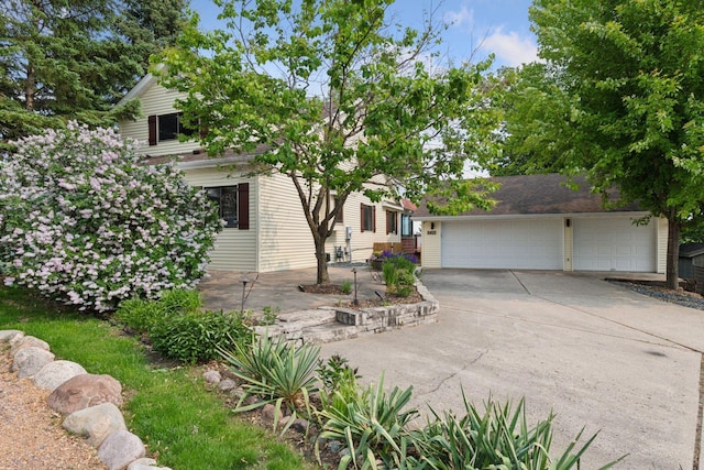 2452 Black Lake Rd, Spring Park, MN 55384 - view of property hidden behind natural elements featuring concrete driveway