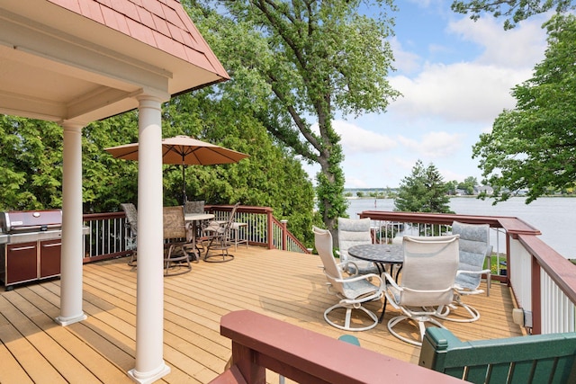 2452 Black Lake Rd, Spring Park, MN 55384 - deck featuring outdoor dining space, a water view, and grilling area