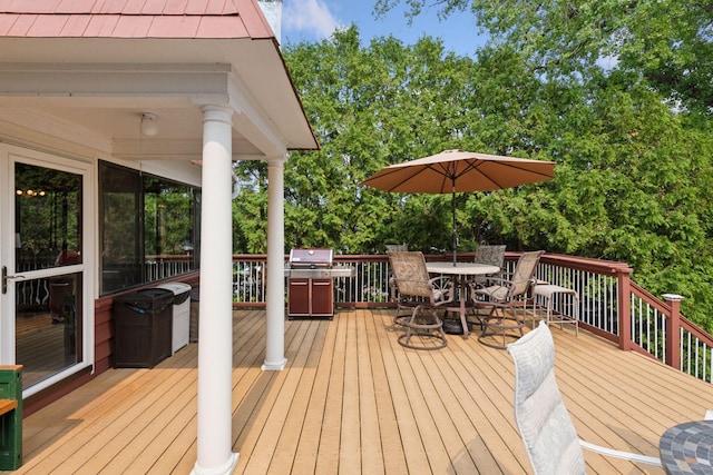 2452 Black Lake Rd, Spring Park, MN 55384 - deck featuring outdoor dining space and view of scattered trees