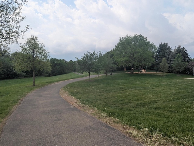 surrounding community with a yard