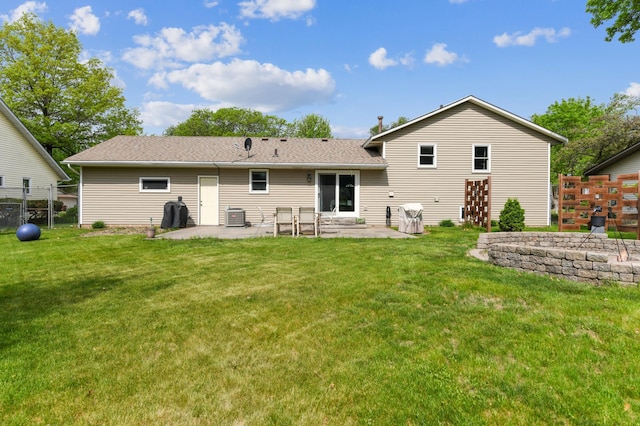 rear view of house featuring a patio area, roof with shingles, and cooling unit