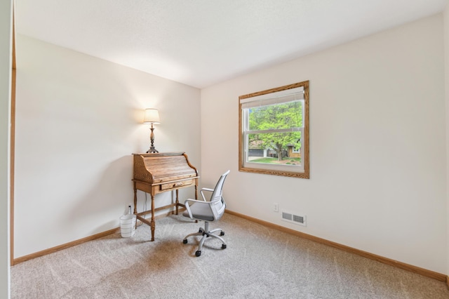 home office featuring carpet flooring and baseboards