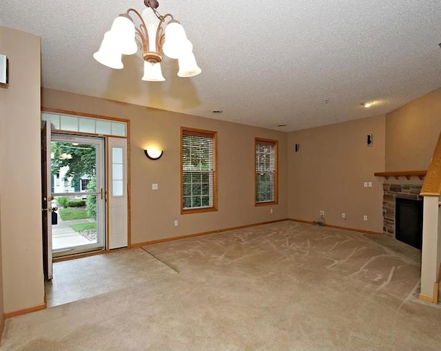 15437 Frost Path Unit 1507, Apple Valley, MN 55124 - unfurnished living room featuring a chandelier, light carpet, a textured ceiling, baseboards, and a fireplace