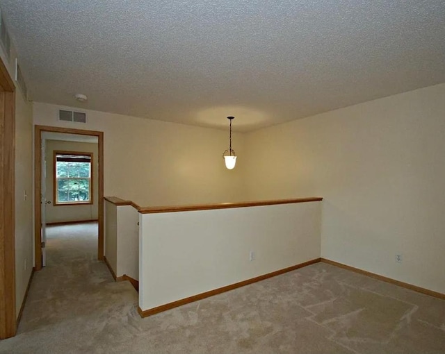 15437 Frost Path Unit 1507, Apple Valley, MN 55124 - empty room with light colored carpet, a textured ceiling, and baseboards