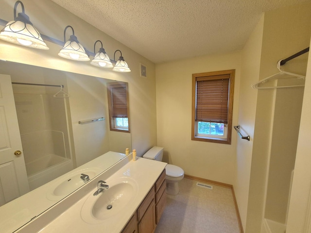 15437 Frost Path Unit 1507, Apple Valley, MN 55124 - bathroom featuring a textured ceiling, vanity, baseboards, and toilet