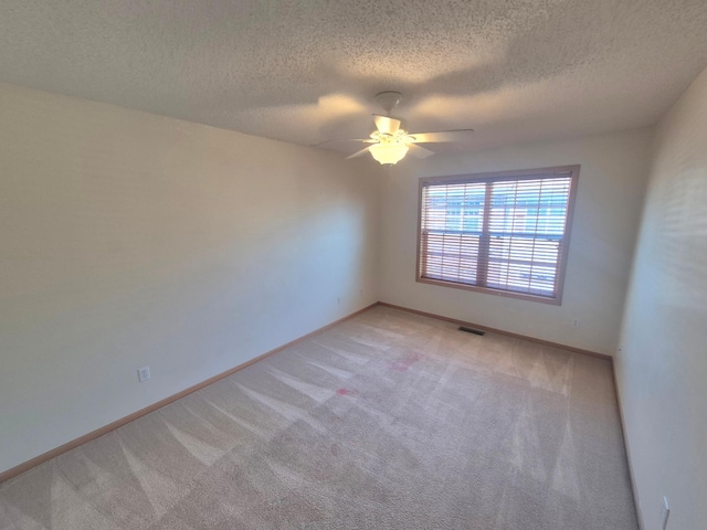 15437 Frost Path Unit 1507, Apple Valley, MN 55124 - unfurnished room featuring light colored carpet, a ceiling fan, a textured ceiling, and baseboards
