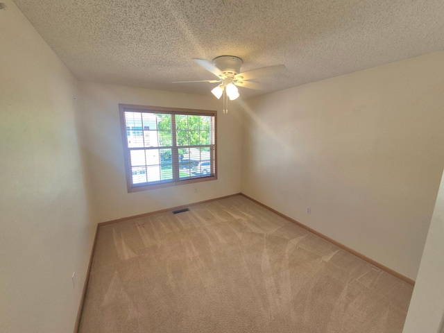 15437 Frost Path Unit 1507, Apple Valley, MN 55124 - empty room with light colored carpet, ceiling fan, baseboards, and a textured ceiling