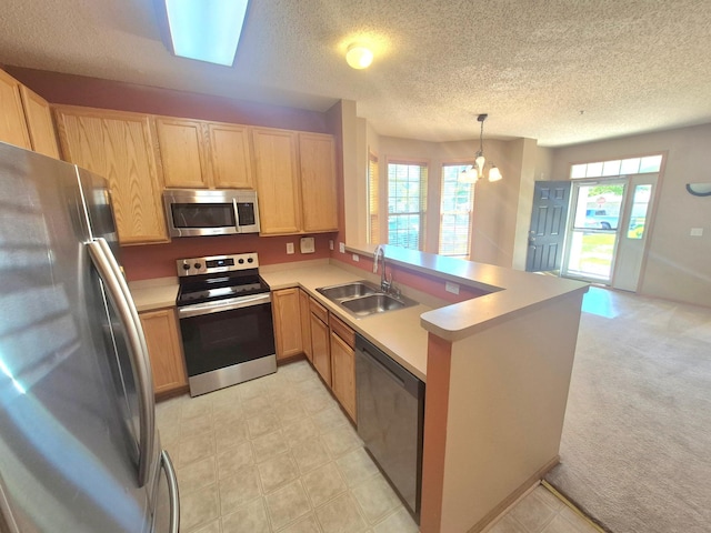 15437 Frost Path Unit 1507, Apple Valley, MN 55124 - kitchen featuring stainless steel appliances, a sink, a peninsula, a textured ceiling, and light countertops