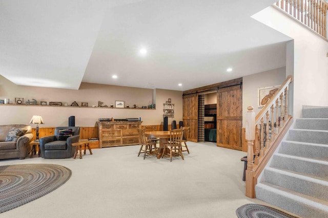 14464 Grouse Ln, Fifty Lakes, MN 56448 - dining area with a barn door, stairway, light carpet, and recessed lighting