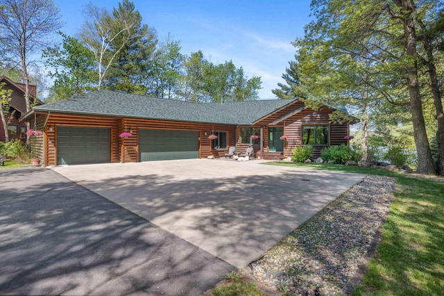 14464 Grouse Ln, Fifty Lakes, MN 56448 - cabin with a garage, driveway, and a shingled roof