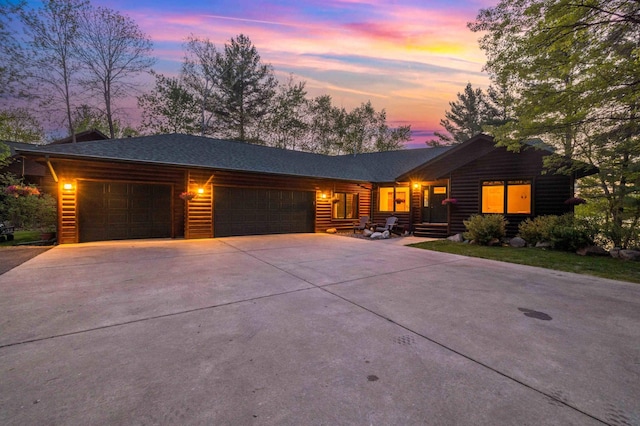 14464 Grouse Ln, Fifty Lakes, MN 56448 - view of front of house featuring an attached garage and concrete driveway