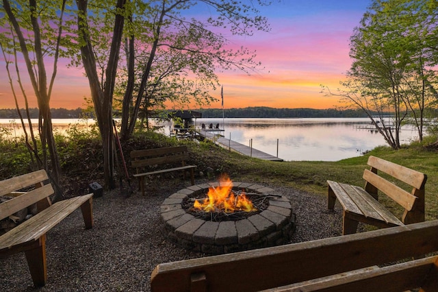 14464 Grouse Ln, Fifty Lakes, MN 56448 - view of patio / terrace featuring a fire pit, a water view, and a boat dock