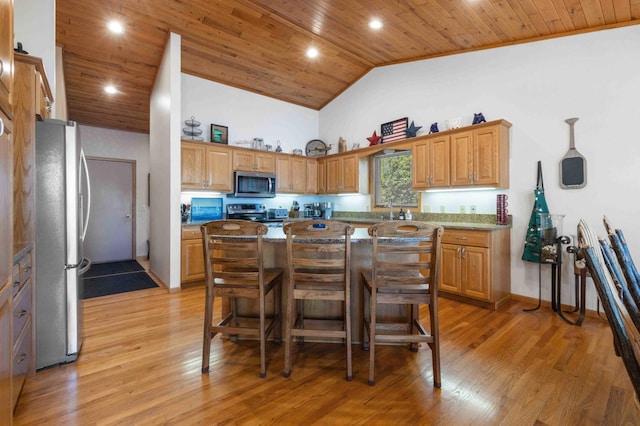 14464 Grouse Ln, Fifty Lakes, MN 56448 - kitchen with stainless steel appliances, wood ceiling, a kitchen island, high vaulted ceiling, and a kitchen breakfast bar