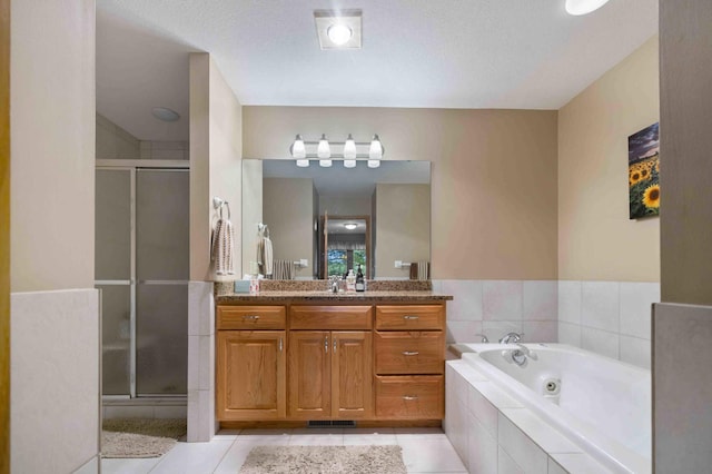 14464 Grouse Ln, Fifty Lakes, MN 56448 - bathroom with vanity, tile patterned flooring, a stall shower, and a tub with jets