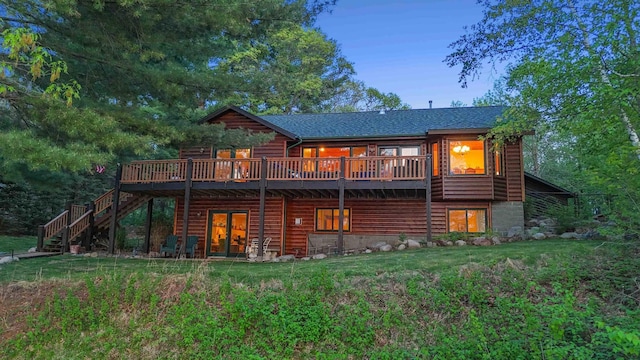 14464 Grouse Ln, Fifty Lakes, MN 56448 - rear view of house with a wooden deck, stairway, and a yard
