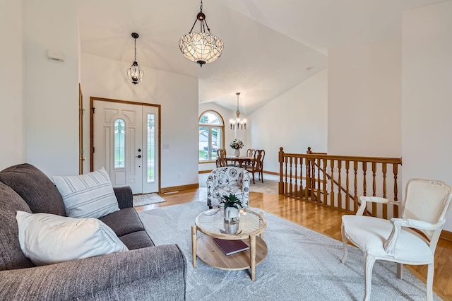 13546 Maryland Ave, Savage, MN 55378 - living room with a chandelier, lofted ceiling, and light wood-style floors