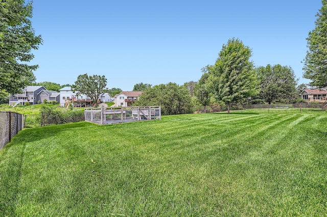 13546 Maryland Ave, Savage, MN 55378 - fenced backyard with a vegetable garden and a residential view