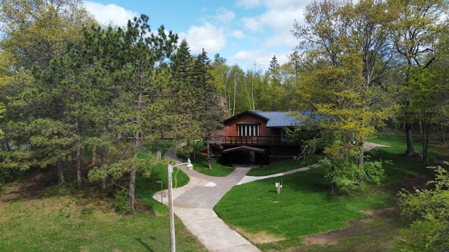 3245 Laketown Rd, Sturgeon Lake, MN 55783 - view of property's community with a lawn, a deck, and a forest view