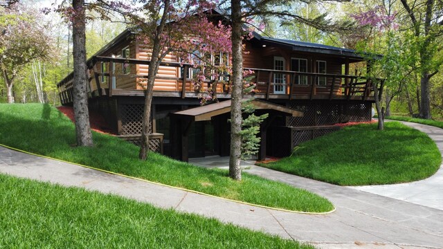 3245 Laketown Rd, Sturgeon Lake, MN 55783 - rear view of property featuring a wooden deck and faux log siding