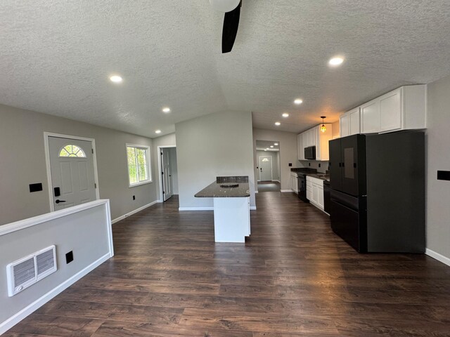3245 Laketown Rd, Sturgeon Lake, MN 55783 - kitchen with black appliances, ceiling fan, dark countertops, lofted ceiling, and white cabinets