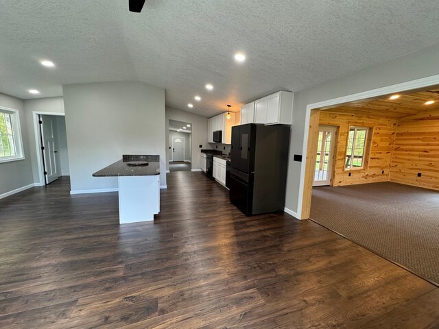 3245 Laketown Rd, Sturgeon Lake, MN 55783 - kitchen featuring freestanding refrigerator, open floor plan, white cabinets, dark wood finished floors, and recessed lighting