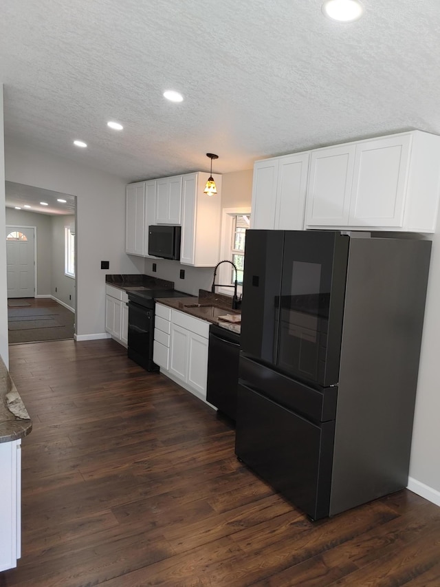 3245 Laketown Rd, Sturgeon Lake, MN 55783 - kitchen featuring black appliances, a sink, dark countertops, white cabinetry, and recessed lighting