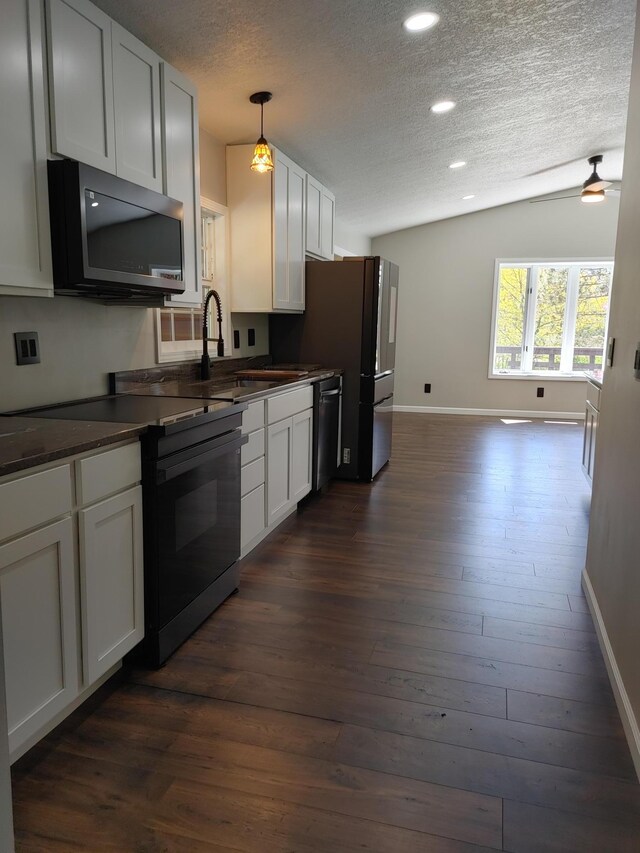 3245 Laketown Rd, Sturgeon Lake, MN 55783 - kitchen featuring black electric range oven, dark countertops, a textured ceiling, dishwasher, and baseboards
