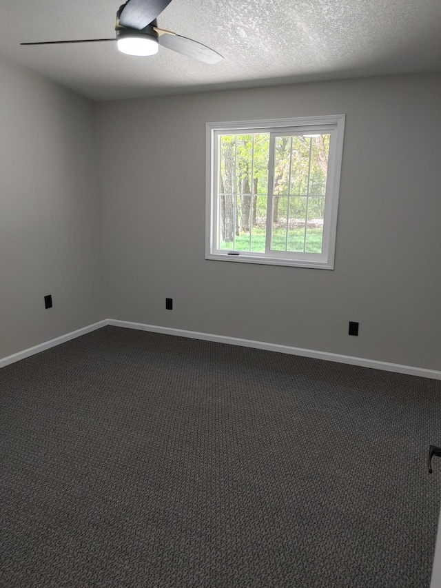 3245 Laketown Rd, Sturgeon Lake, MN 55783 - empty room with carpet flooring, ceiling fan, baseboards, and a textured ceiling