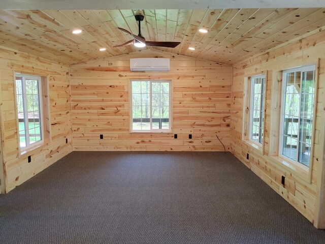 3245 Laketown Rd, Sturgeon Lake, MN 55783 - unfurnished room featuring carpet flooring, wood walls, vaulted ceiling, a ceiling fan, and a wall mounted AC