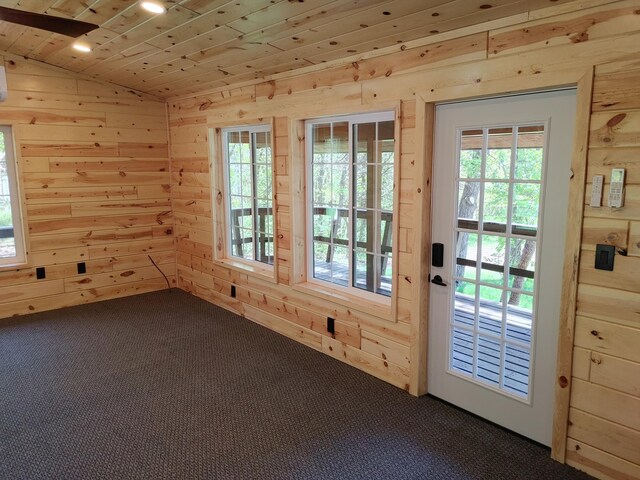 3245 Laketown Rd, Sturgeon Lake, MN 55783 - doorway with dark carpet, wooden walls, lofted ceiling, and wooden ceiling