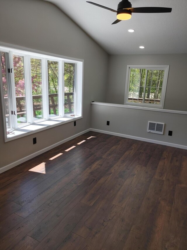 3245 Laketown Rd, Sturgeon Lake, MN 55783 - spare room with dark wood-style floors, ceiling fan, lofted ceiling, baseboards, and recessed lighting