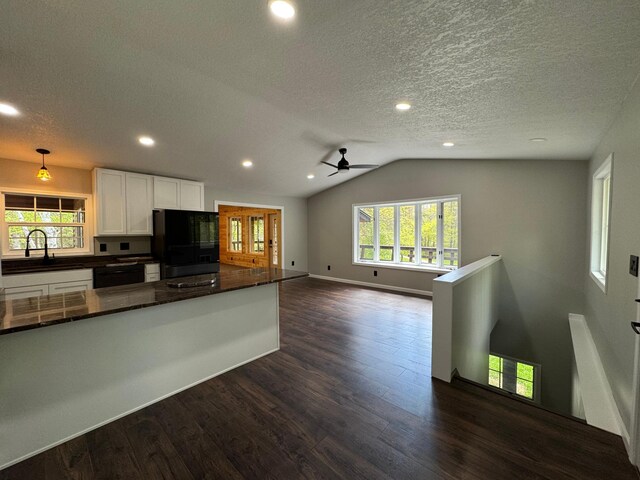 3245 Laketown Rd, Sturgeon Lake, MN 55783 - kitchen with black refrigerator, a sink, a ceiling fan, white cabinets, and dark wood-type flooring